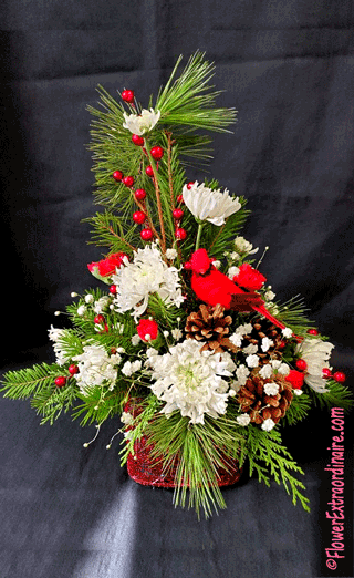 red and white floral arrangement with cardinal